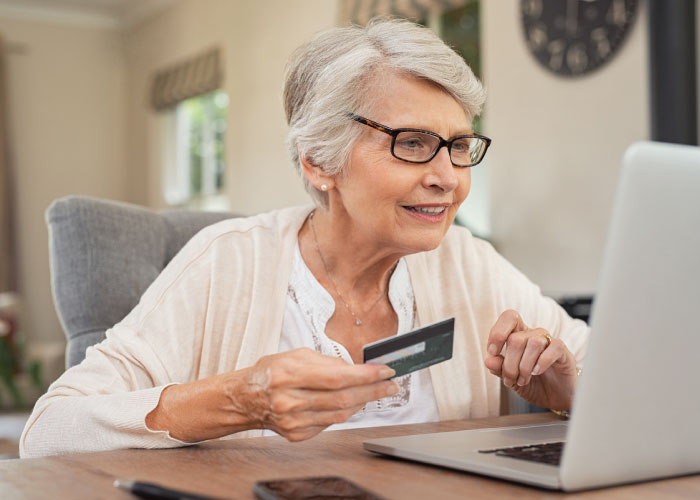 old-woman-paying-bills-online-image-new-baden-il